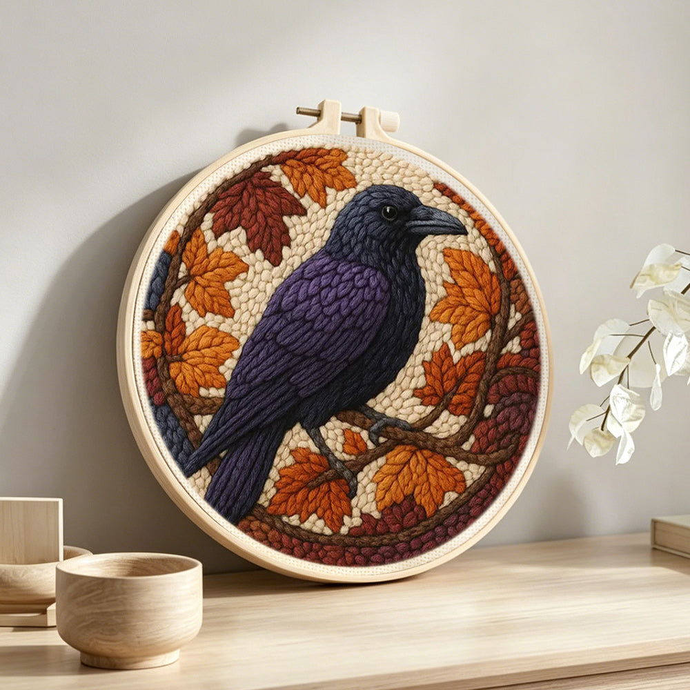 Autumn raven punch needle artwork displayed on a table