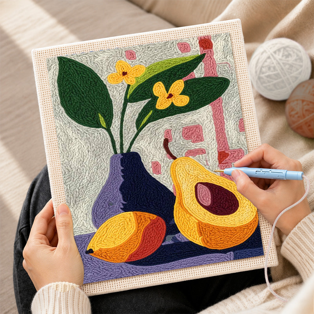 Creating handmade avocado and flowers still life punch needle artwork