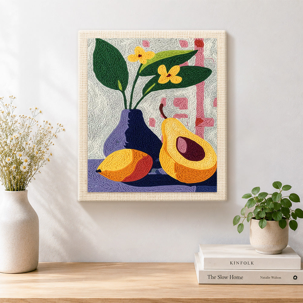 Finished avocado and flowers still life artwork displayed on a wall