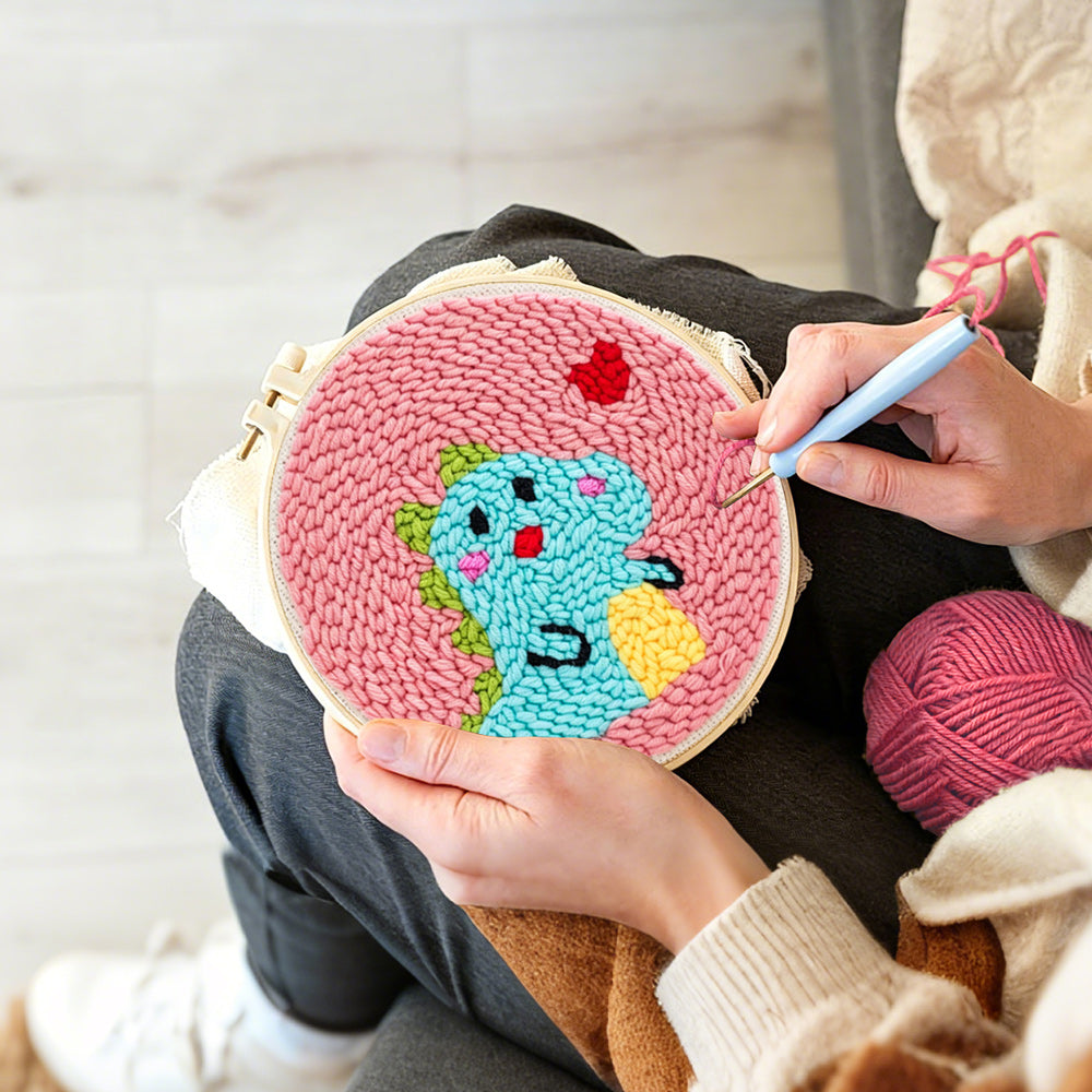 Creating handmade baby dinosaur and little heart punch needle artwork