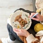 Creating handmade baby highland cow and sunflower punch needle artwork