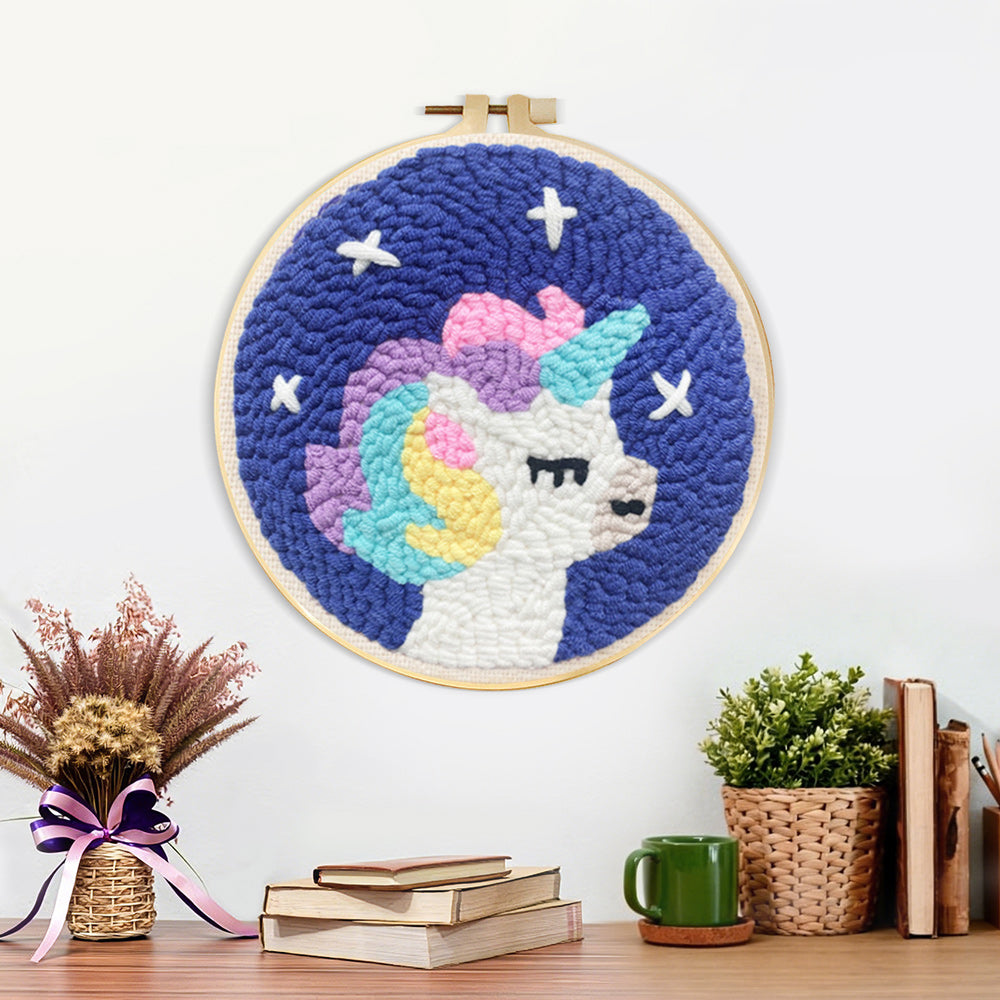 Finished baby unicorn artwork displayed on a wall