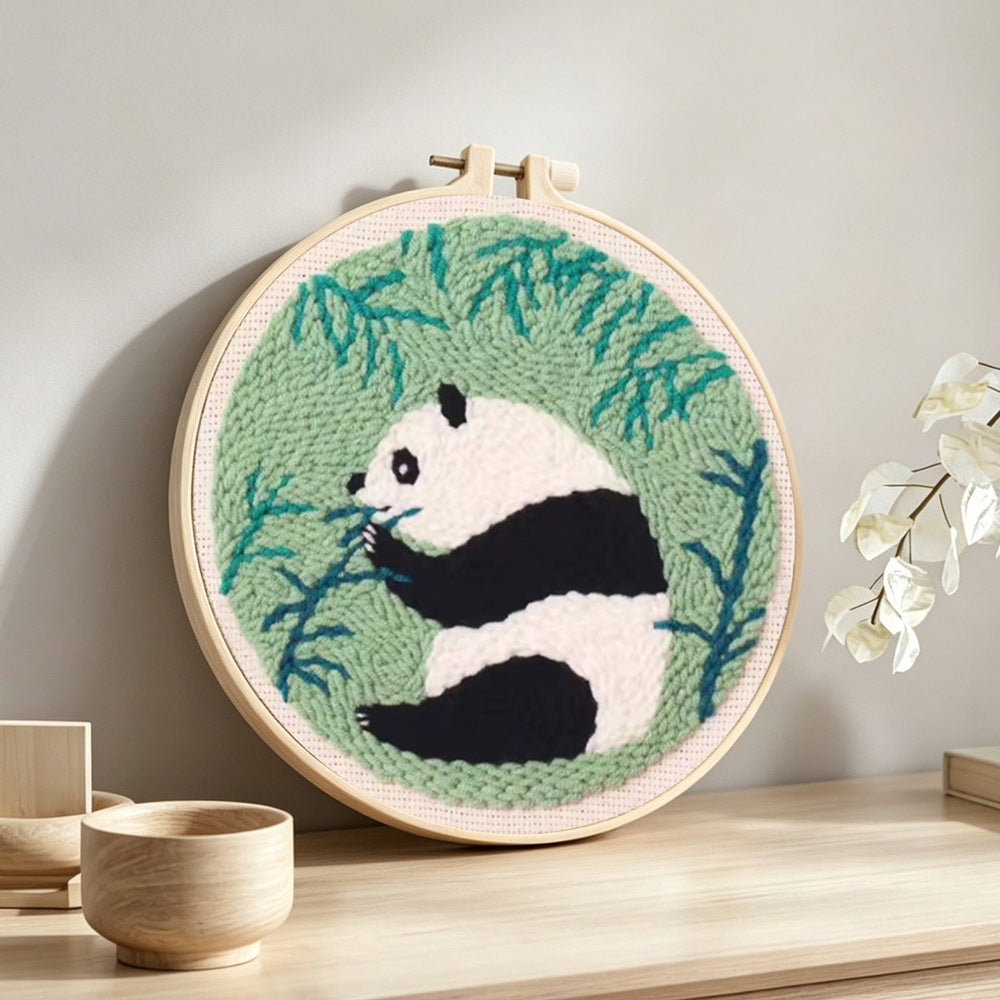 Bamboo lover panda punch needle artwork displayed on a table