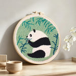 Bamboo lover panda punch needle artwork displayed on a table