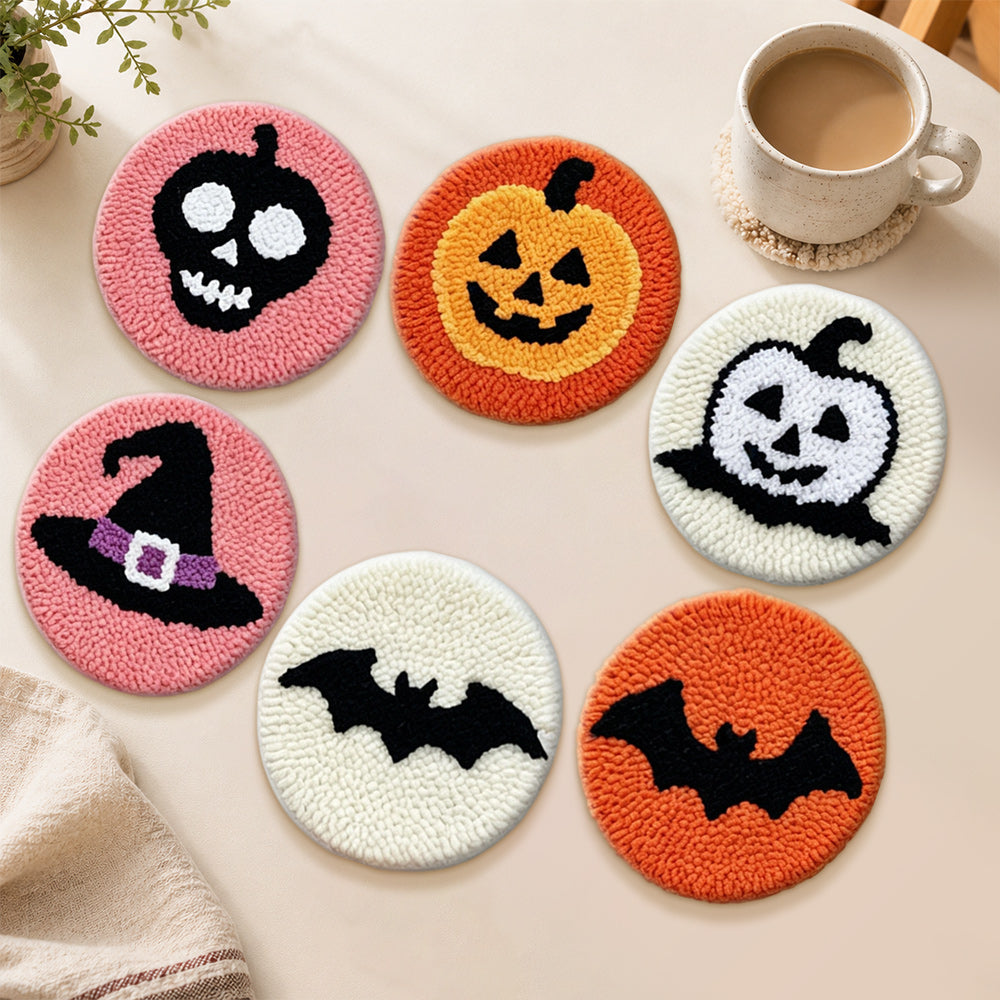 Bat, pumpkin and witch hat punch needle coasters used for home decoration