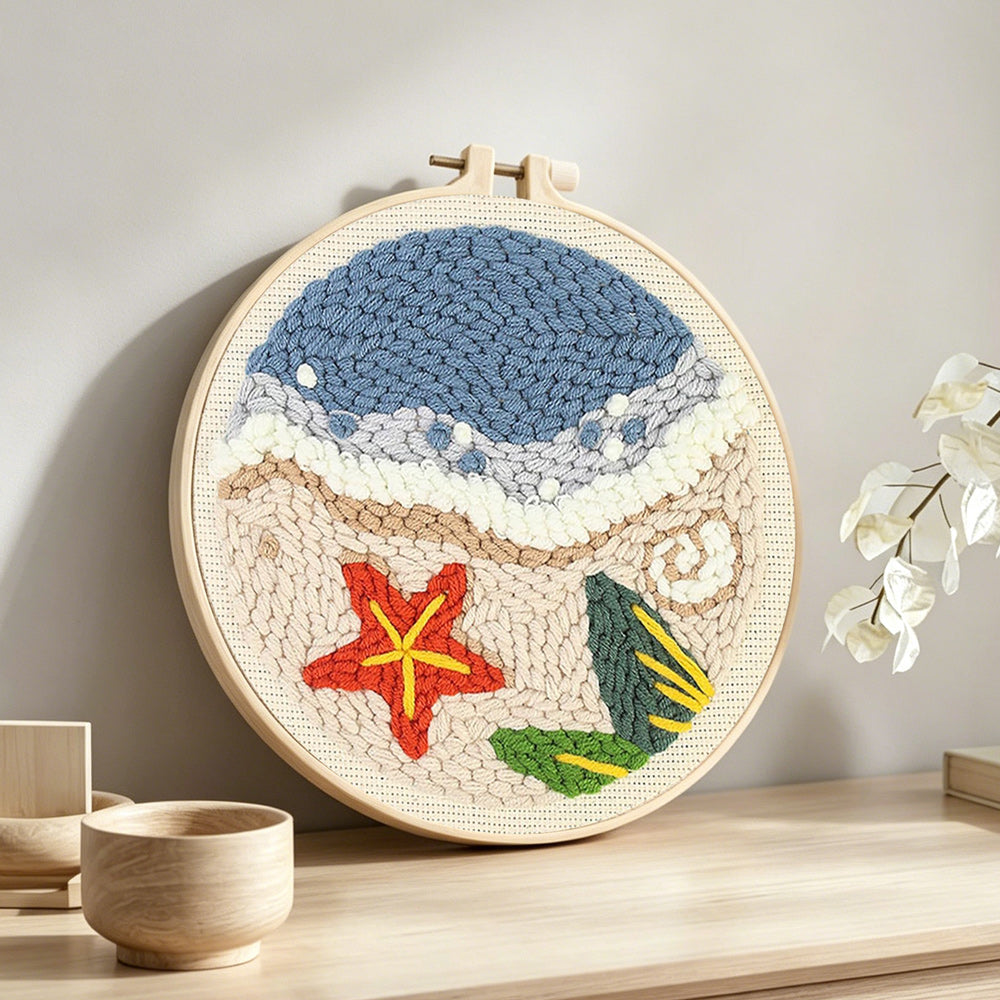 Beach seaside with starfish punch needle artwork displayed on a table