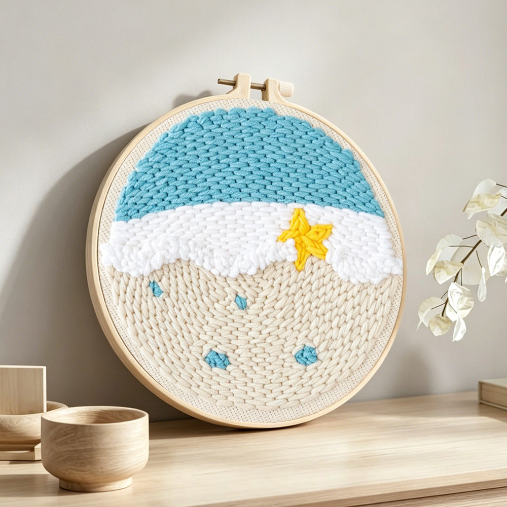 Beach shore with starfish punch needle artwork displayed on a table