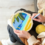 Creating handmade beach with sailboats and tropical leaves punch needle artwork
