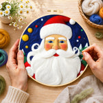 Creating the bearded santa claus wool painting by hand with a felting needle