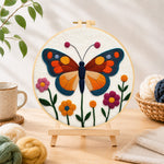 Finished beautiful geometric butterfly needle felting displayed on a wooden easel