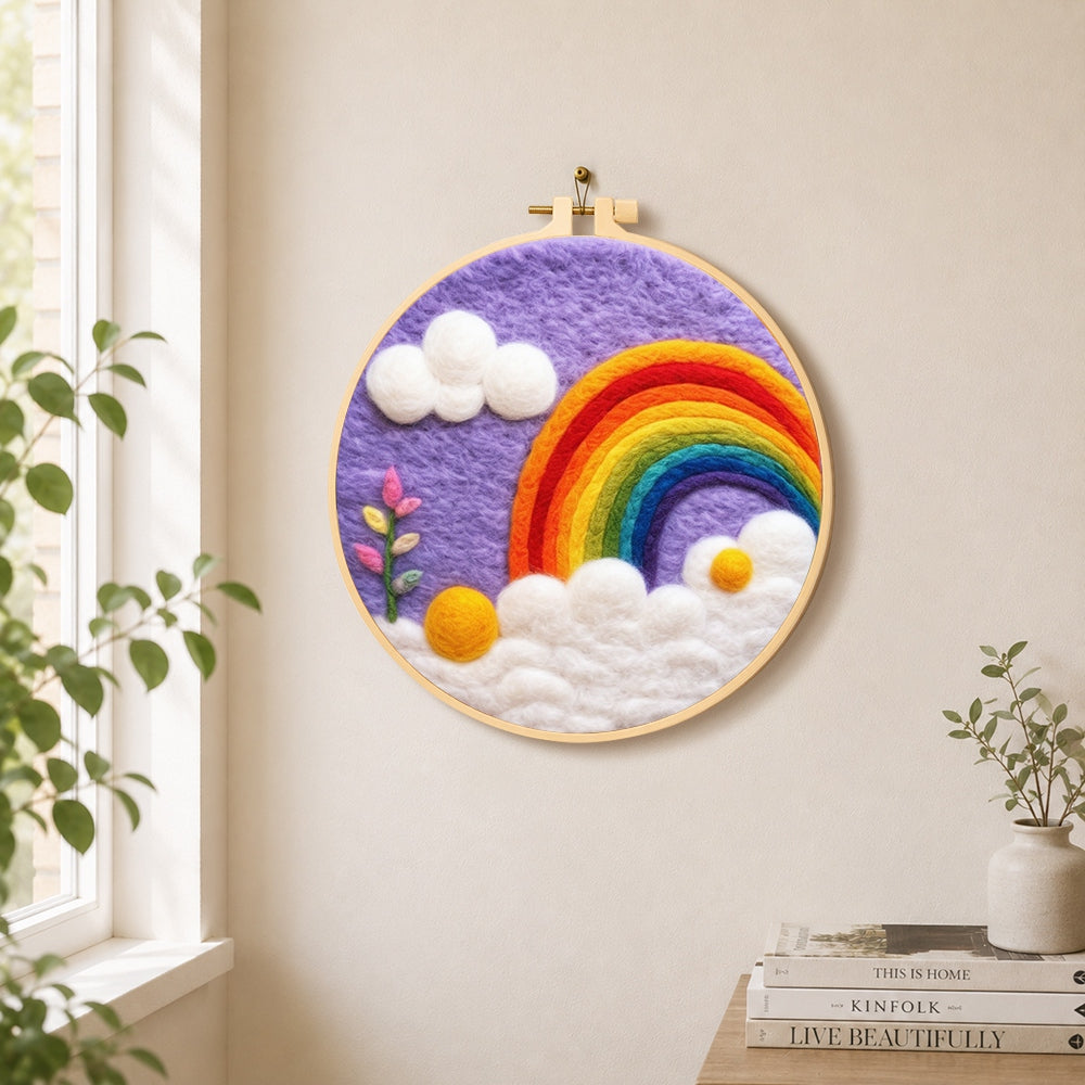 Beautiful rainbow and white clouds in the purple sky needle felt wall art displayed in a bright home interior