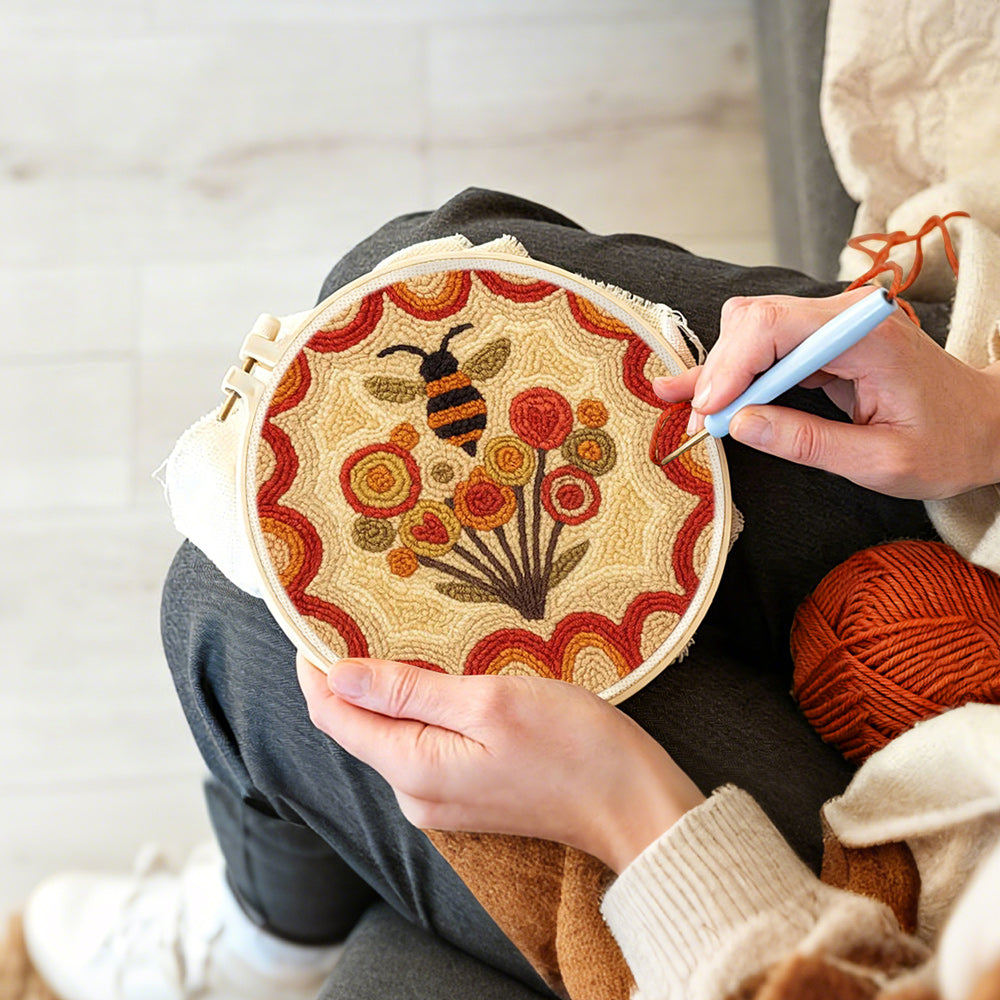 Creating handmade bee and dandelions punch needle artwork