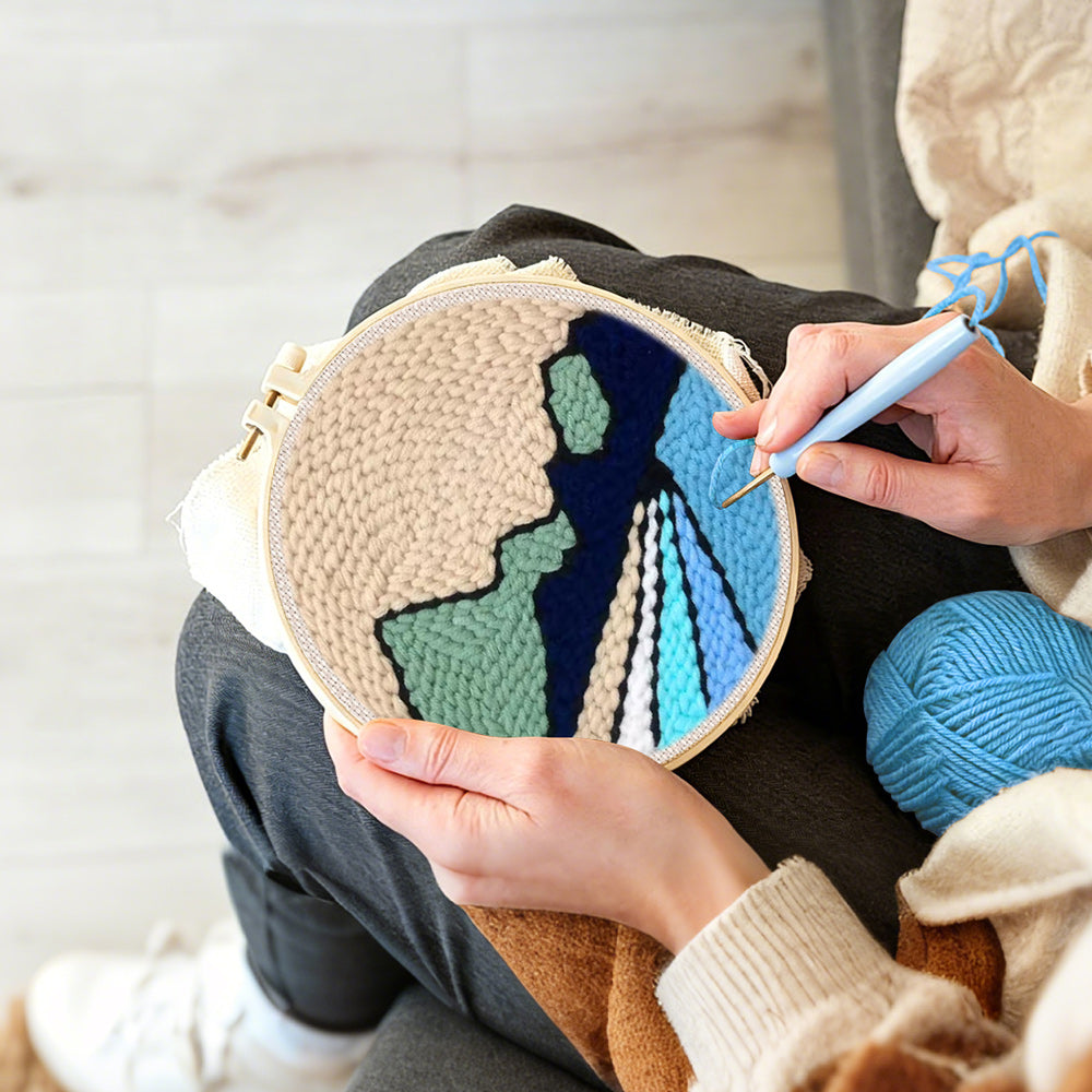 Creating handmade beige sky, green hills and blue rivers punch needle artwork