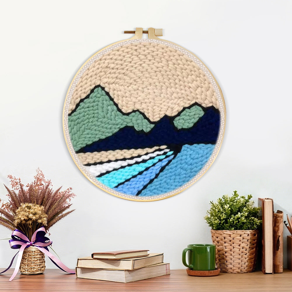 Finished beige sky, green hills and blue rivers artwork displayed on a wall