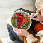 Creating handmade berry cardinal punch needle artwork