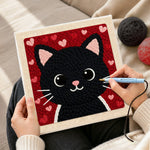 Creating handmade big-eyed black cat face punch needle artwork