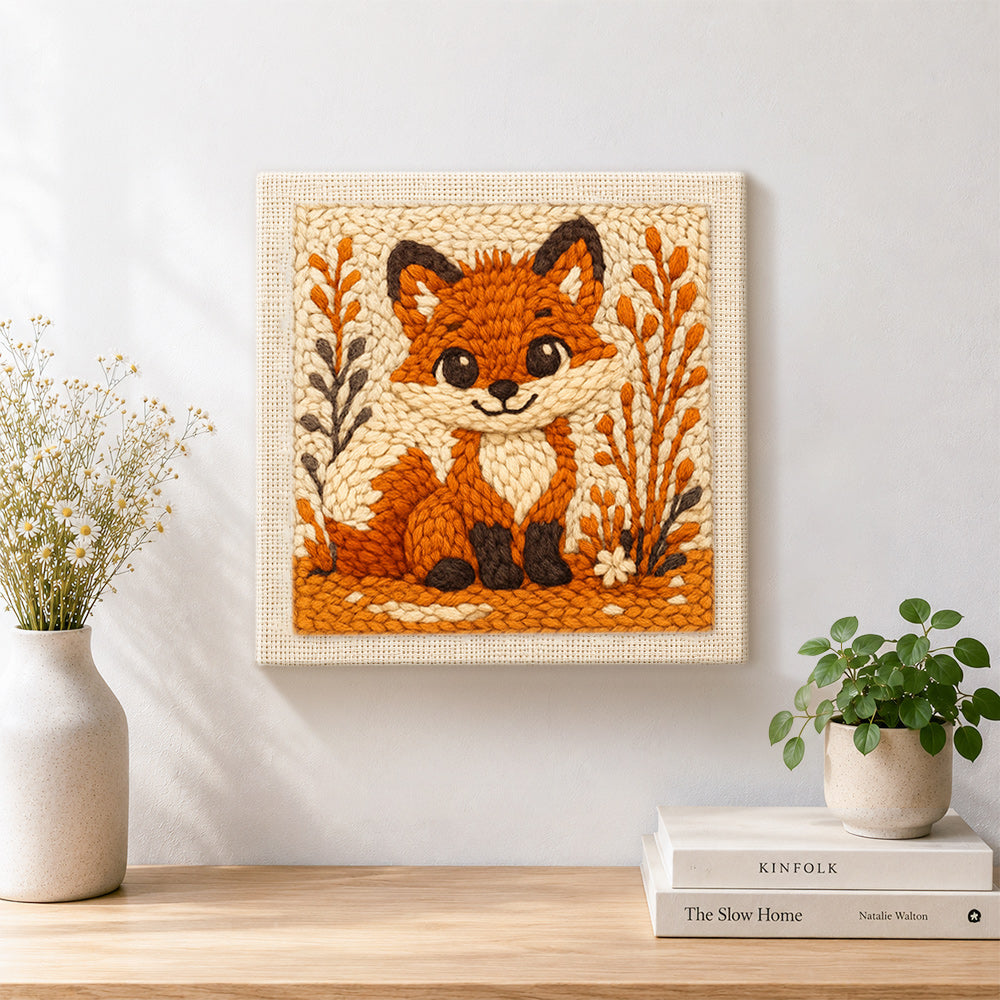 Finished big-eyed fox with autumn grass artwork displayed on a wall