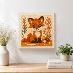 Finished big-eyed fox with autumn grass artwork displayed on a wall