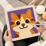 Creating handmade big-eyed orange tabby cat punch needle artwork
