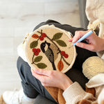 Creating handmade bird and berries punch needle artwork