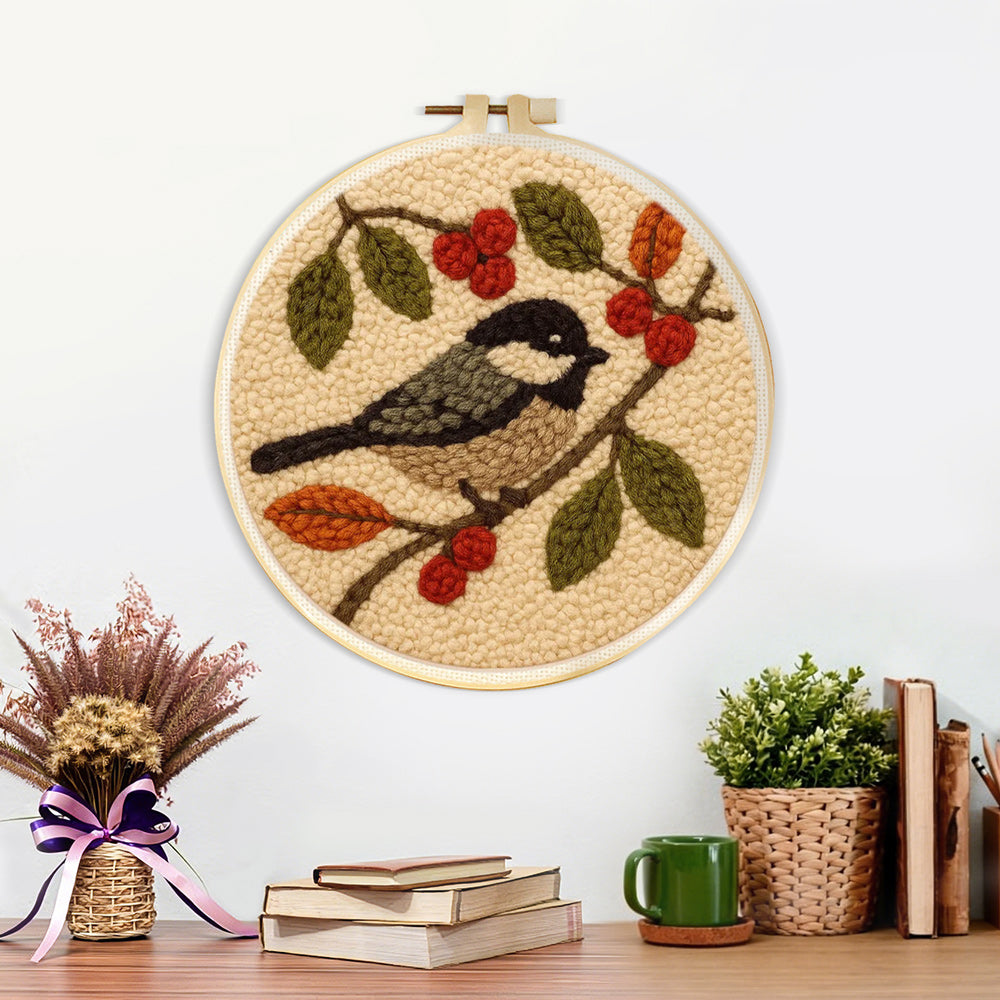 Finished bird and berries artwork displayed on a wall