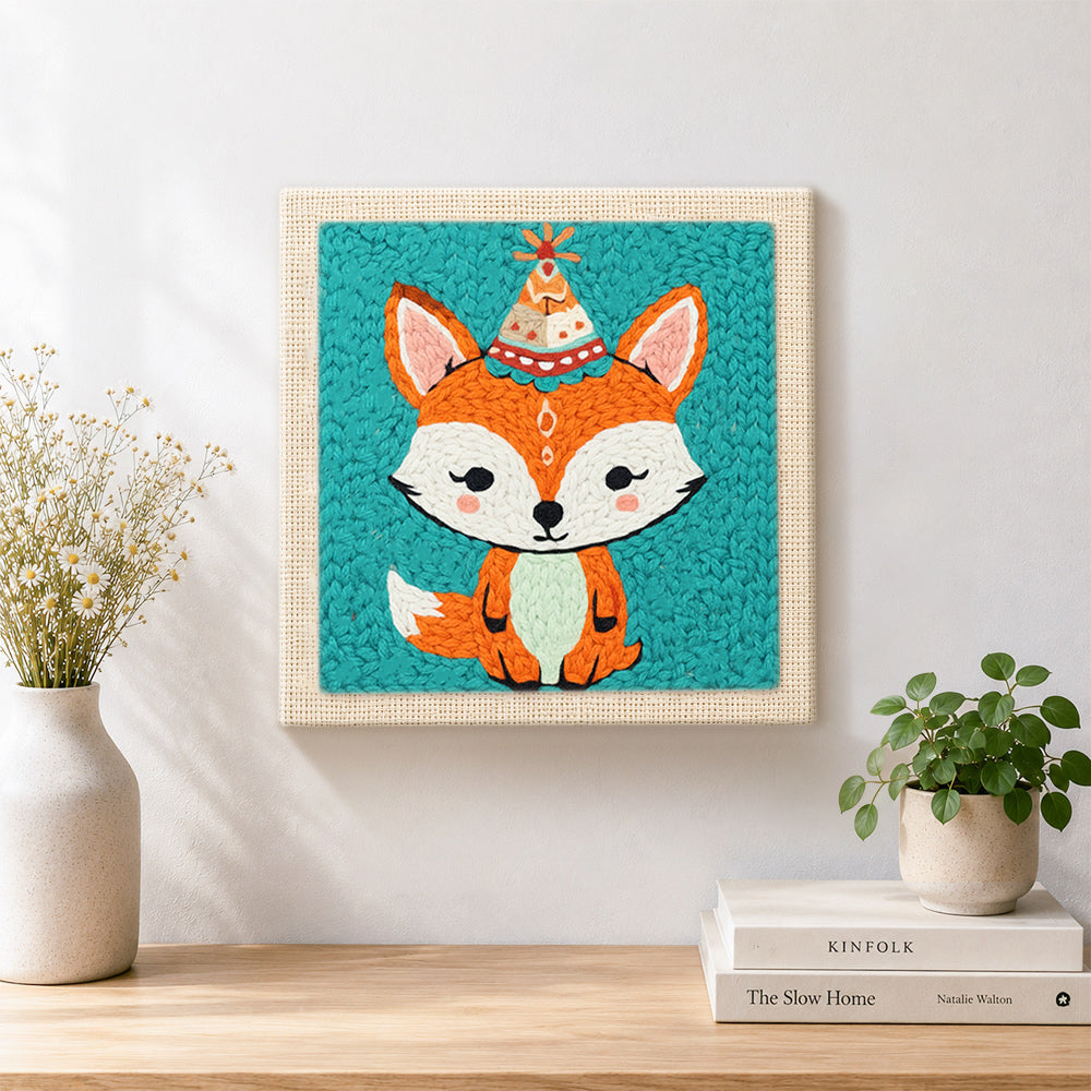 Finished birthday party fox with cone hat artwork displayed on a wall