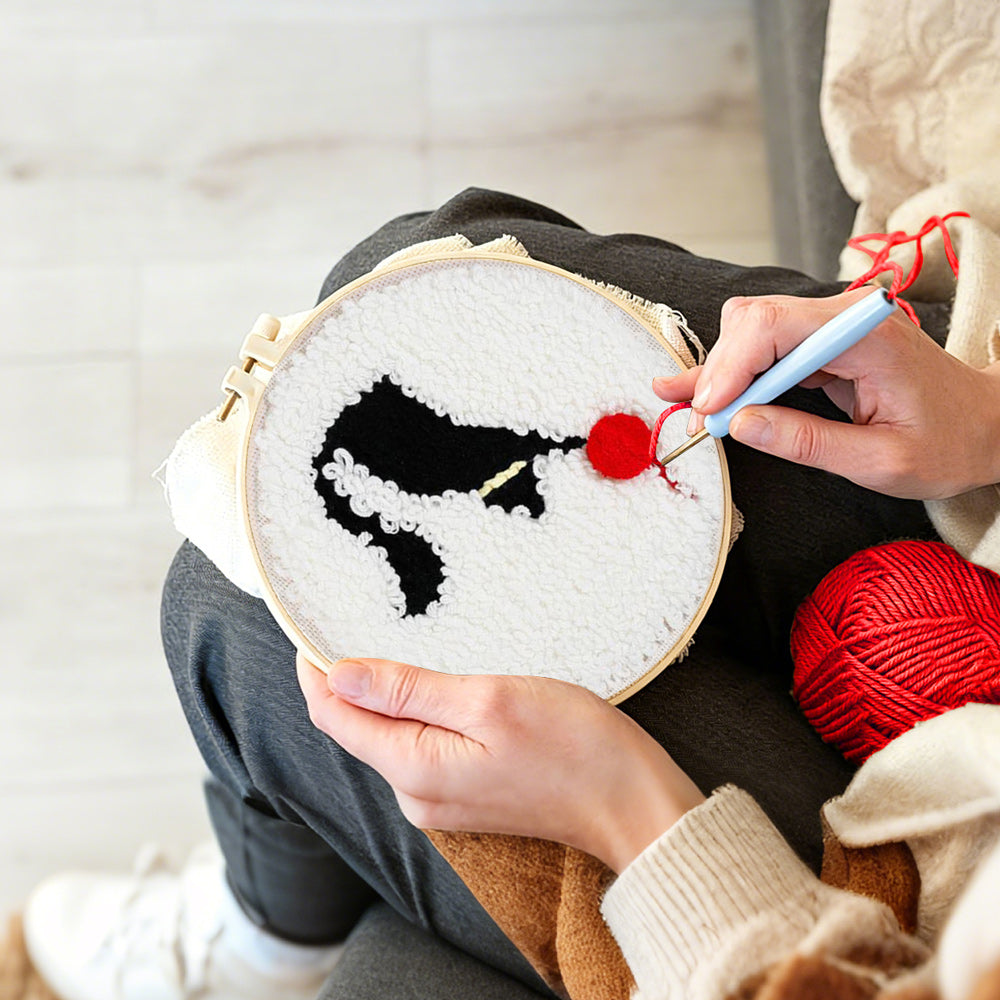 Creating handmade black cat and red ball of yarn punch needle artwork