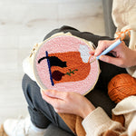 Creating handmade black cat and terracotta vase punch needle artwork