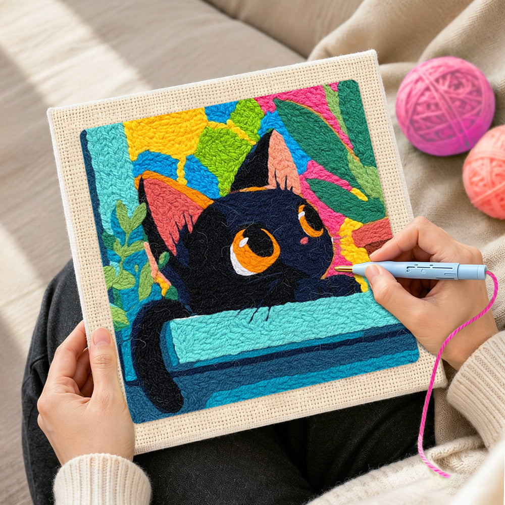 Creating handmade black cat with colourful abstract leaves punch needle artwork