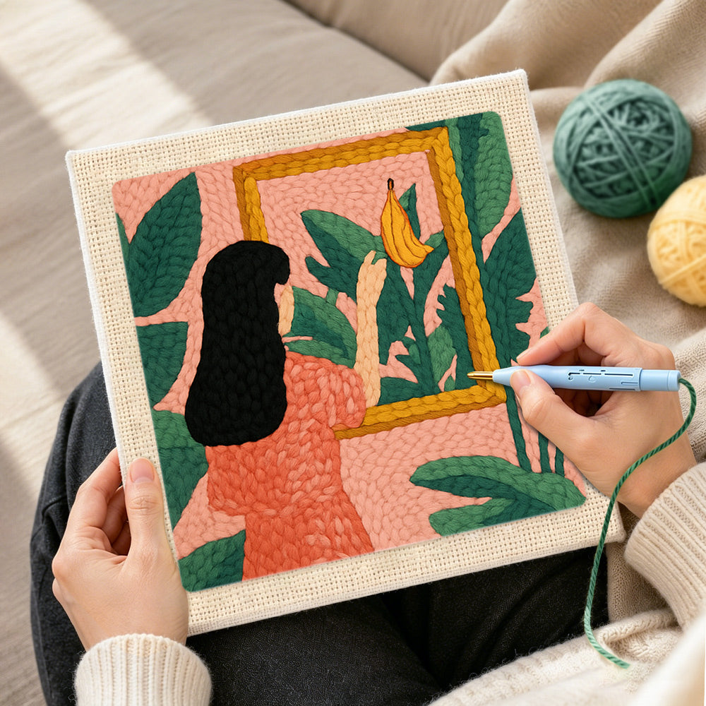 Creating handmade black hair woman, tropical leaves and framed banana punch needle artwork