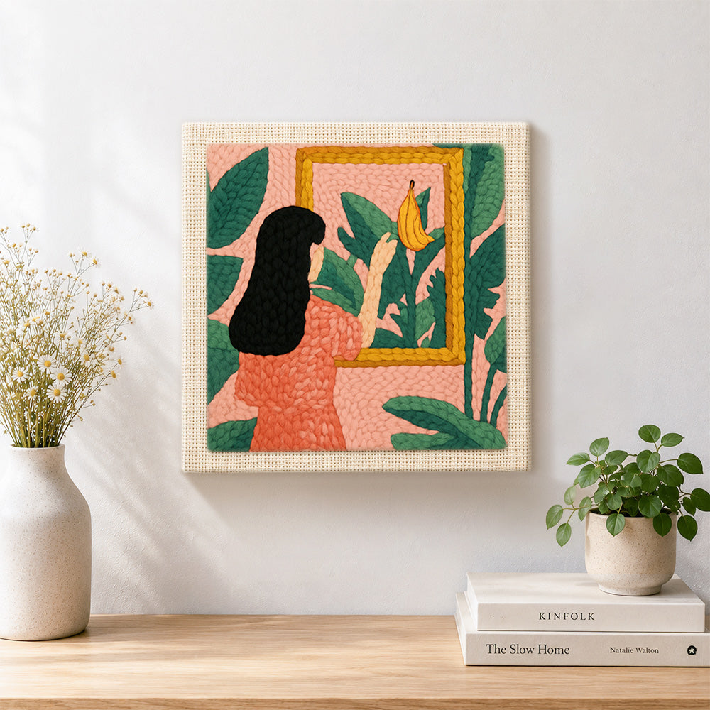 Finished black hair woman, tropical leaves and framed banana artwork displayed on a wall
