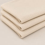 Close-up detail of blank punch needle practice cloth with woven texture