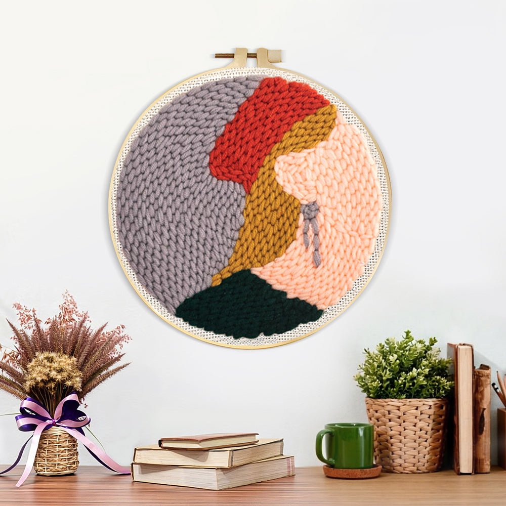 Finished blonde woman in red hat artwork displayed on a wall