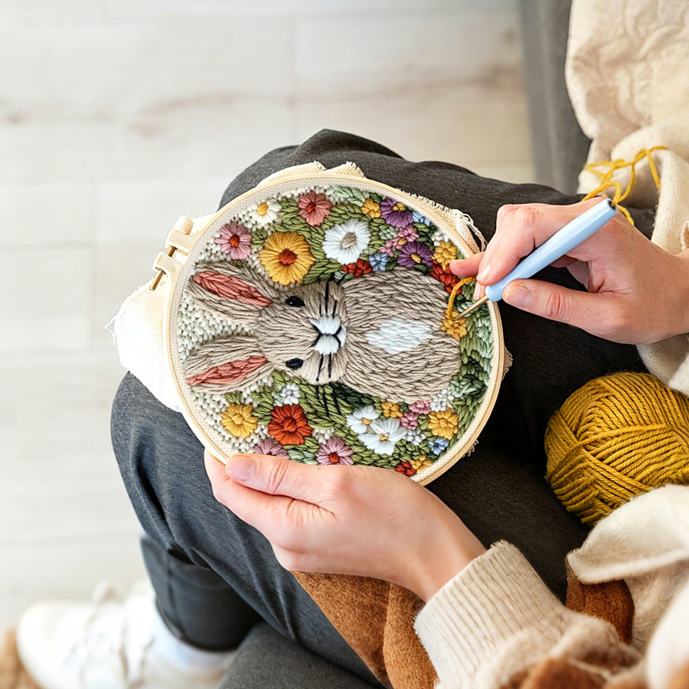 Creating handmade blooming bunny garden punch needle artwork