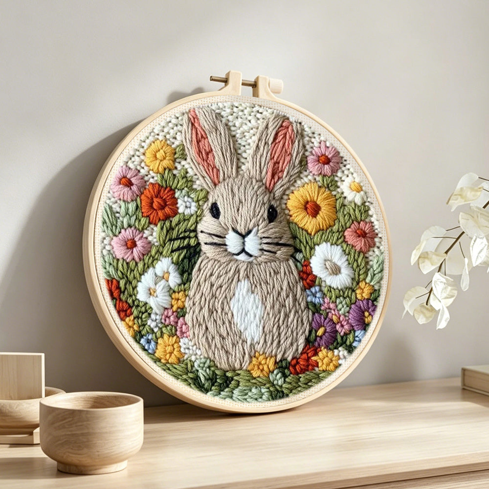 Blooming bunny garden punch needle artwork displayed on a table