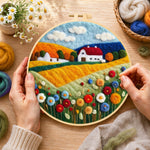 Creating the blooming flower field and red roof cottage wool painting by hand with a felting needle