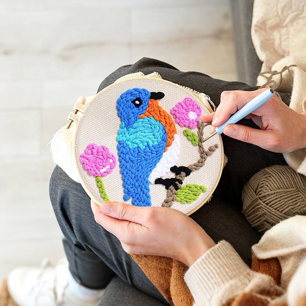 Creating handmade blue bird and pink flowers punch needle artwork