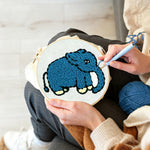 Creating handmade blue elephant punch needle artwork