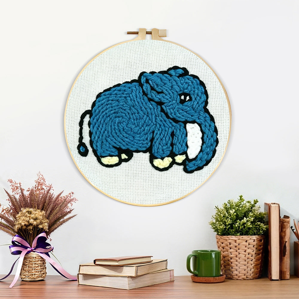Finished blue elephant artwork displayed on a wall