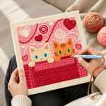 Creating handmade blue-eyed and green-eyed cats peeking punch needle artwork