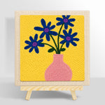 Blue flowers in a pink vase punch needle kit for beginners
