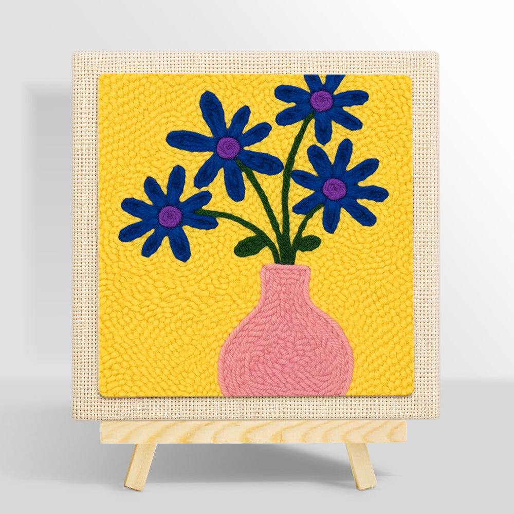 Blue flowers in a pink vase punch needle kit for beginners