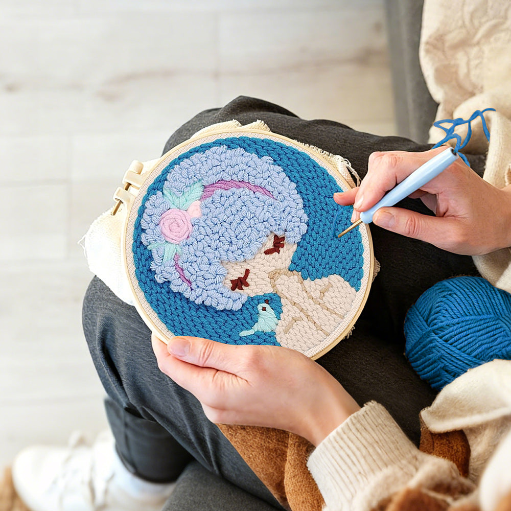 Creating handmade blue haired girl with bird punch needle artwork