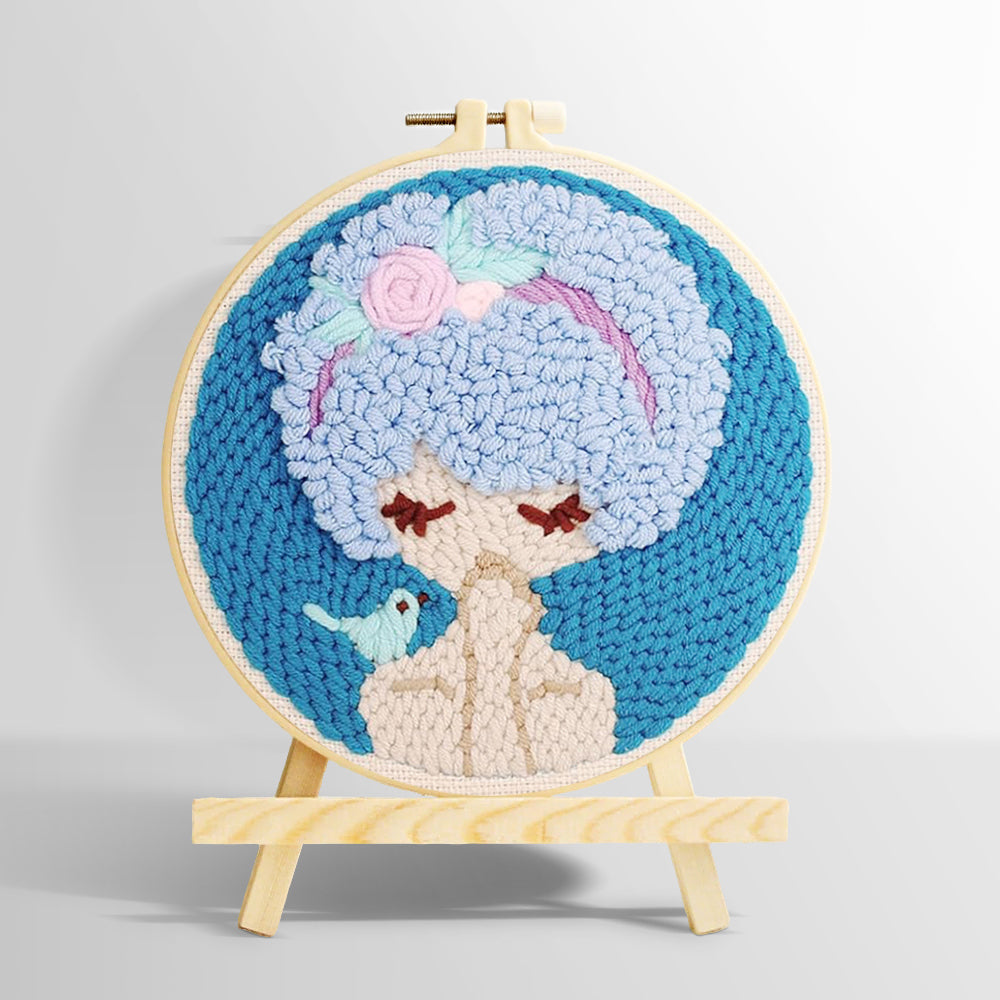 Blue haired girl with bird punch needle kit for beginners
