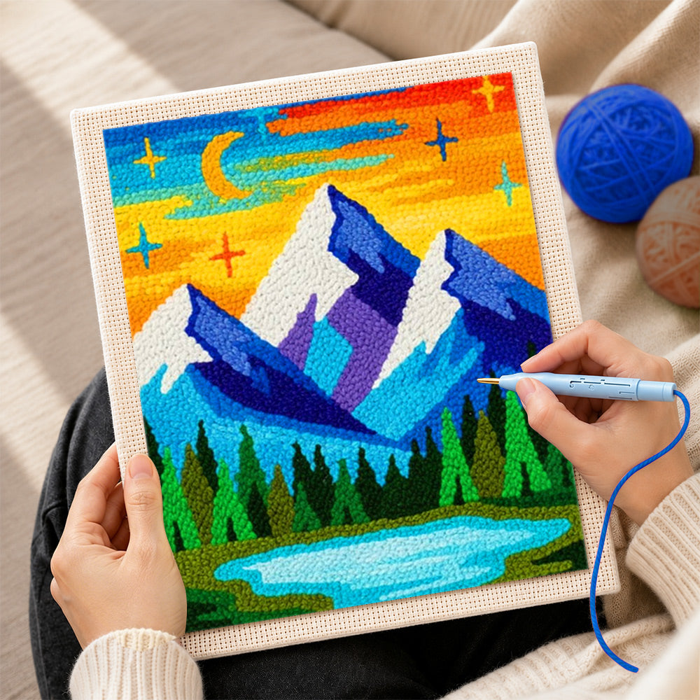 Creating handmade blue mountains under the dreamy starry night punch needle artwork