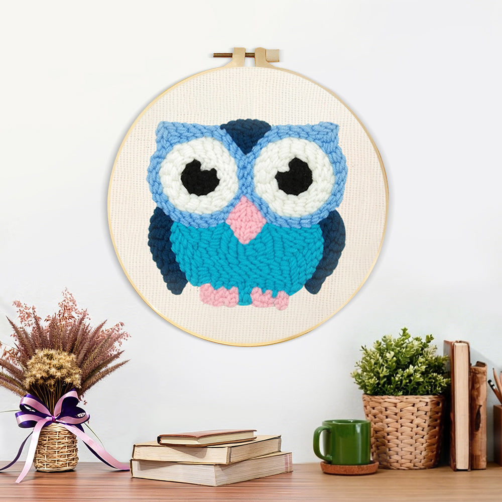 Finished blue owl artwork displayed on a wall