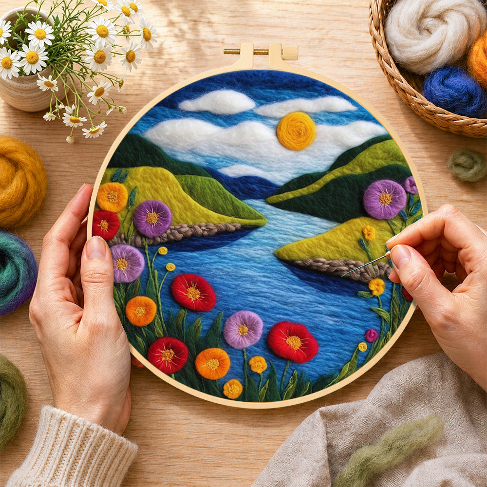 Creating the blue river and enchanting poppies wool painting by hand with a felting needle