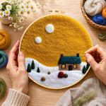 Creating the blue roof cottage under the yellow sky wool painting by hand with a felting needle