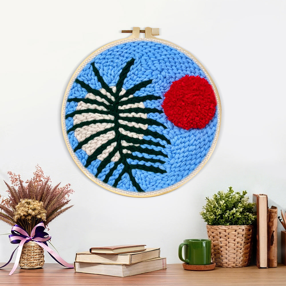 Finished blue sky botanical with red sun artwork displayed on a wall
