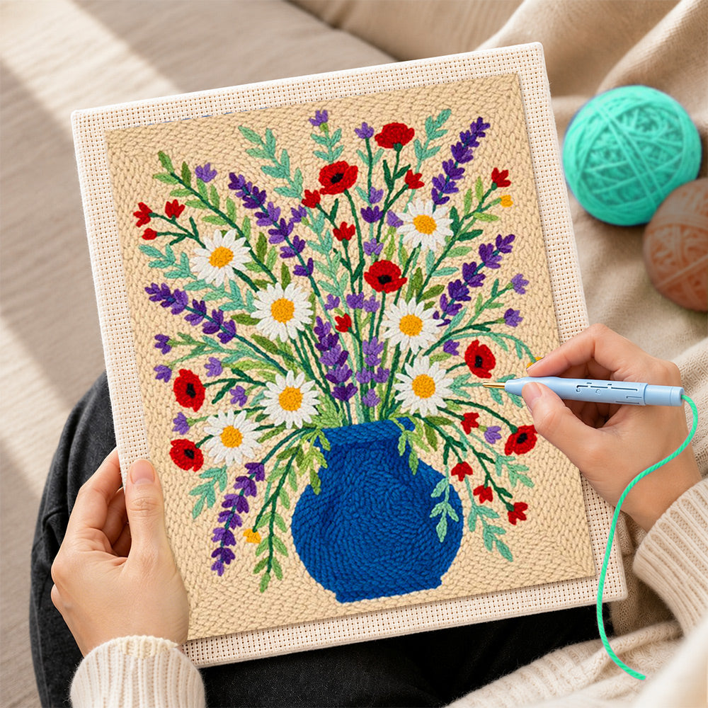 Creating handmade blue vase with lavender, daisies and poppies punch needle artwork